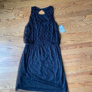 new w tags Black dress with beading.